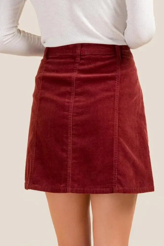 Burgundy button-front mini skirt with flap pockets