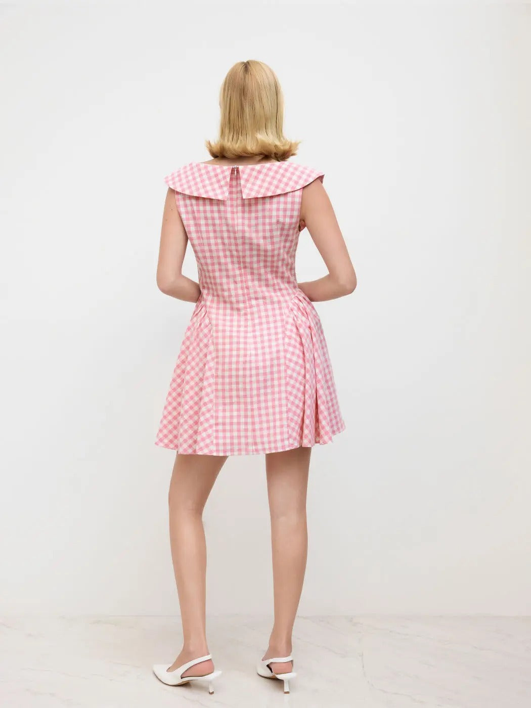 Pink gingham sleeveless mini dress with wide collar
