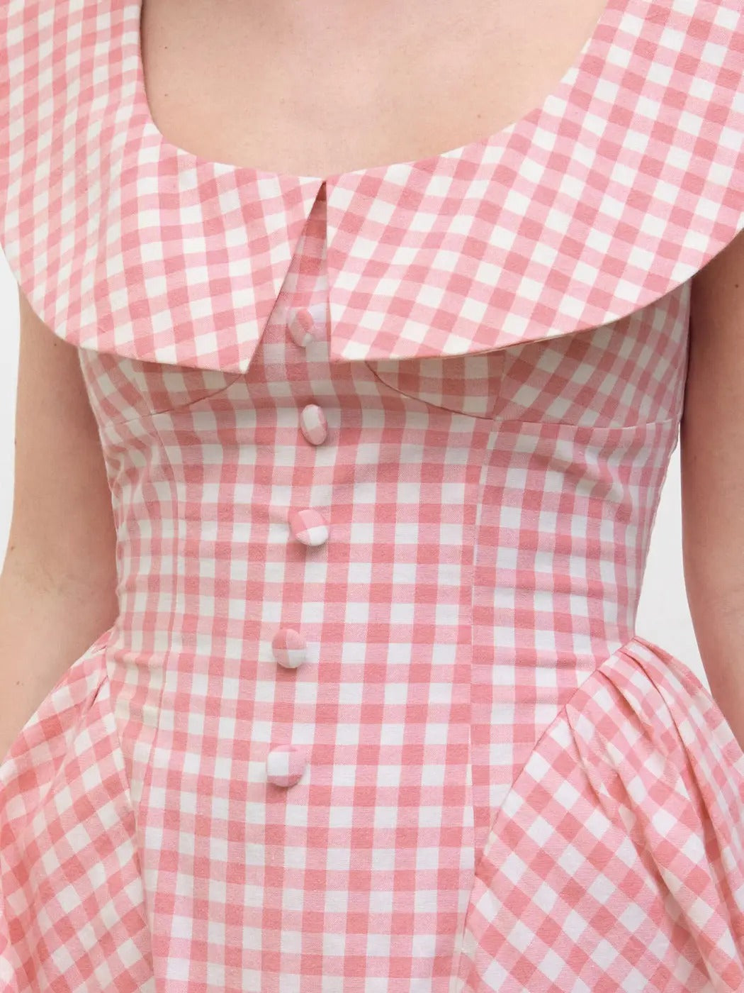 Pink gingham sleeveless mini dress with wide collar